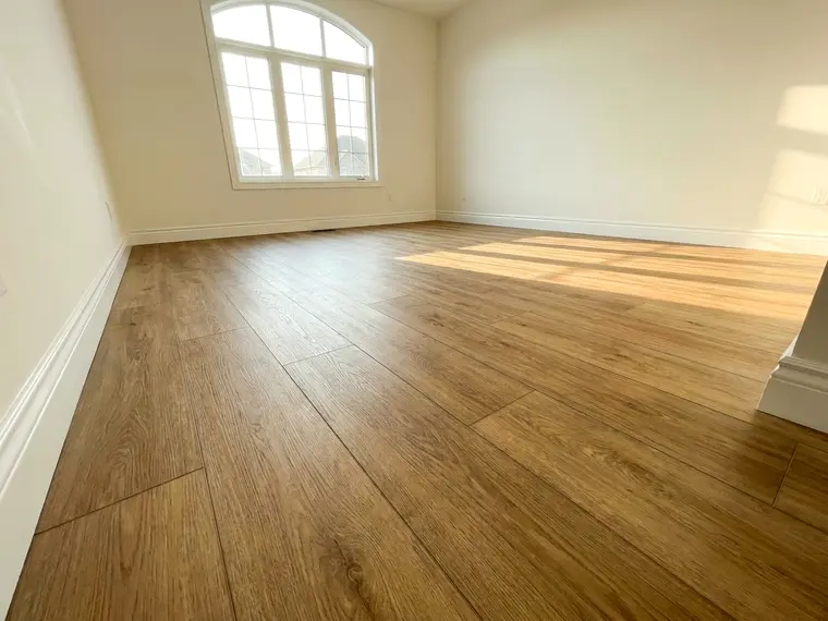 New hardwood flooring installed through a room